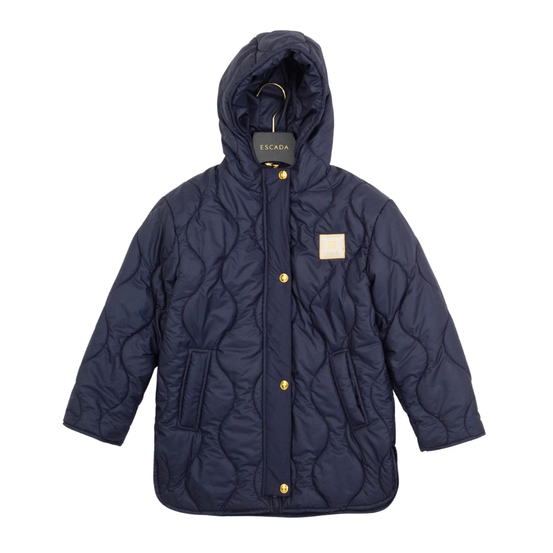 Navy quilted jacket with gold buttons on a white background