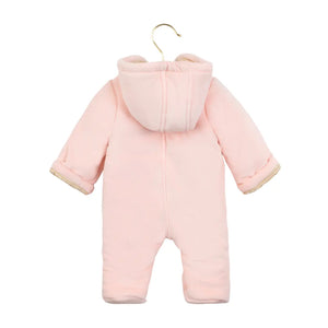 Pink baby snowsuit on a hanger against a white background
