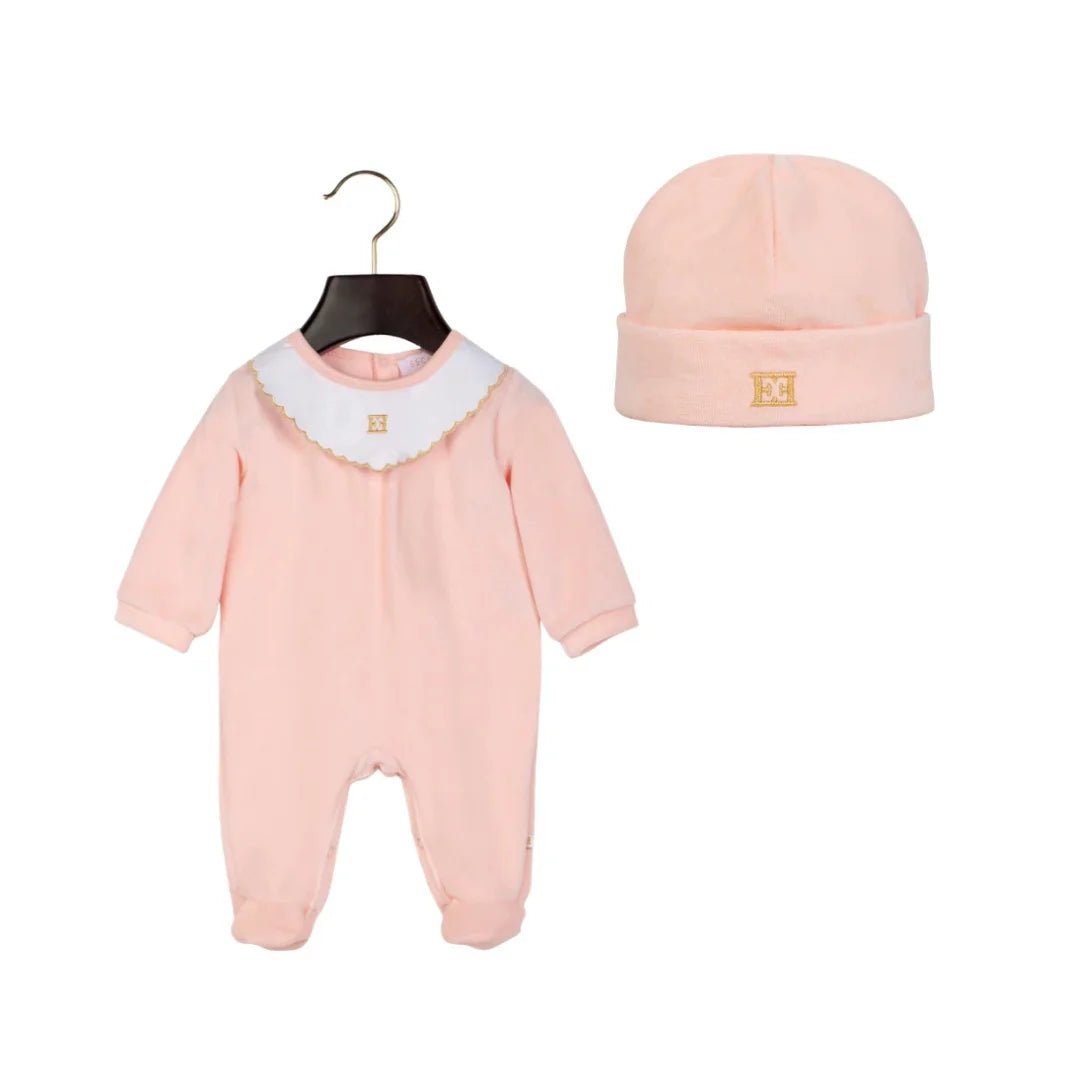 A front view of the luxury Escada bridal rose footie and beanie set.