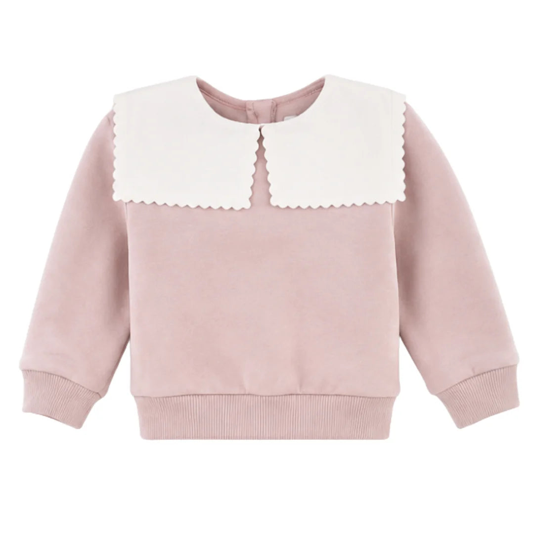 A front view of the soft pink Petit Bateau Clarita baby pullover, highlighting the sailor-style collar.