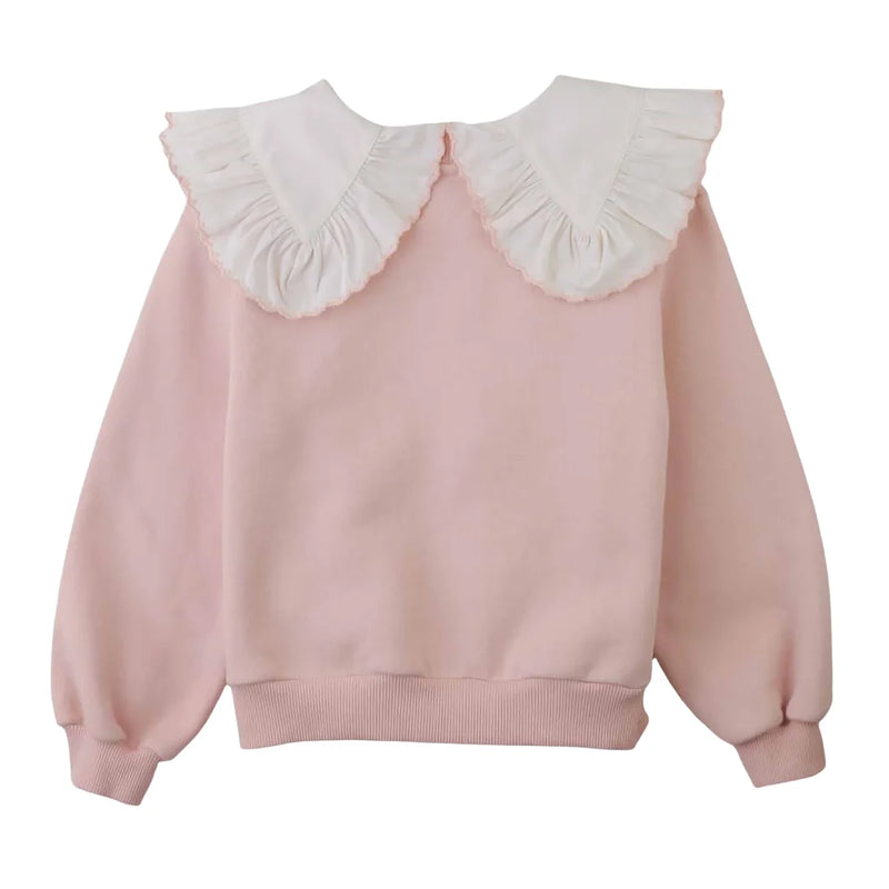 A front view of the Gingersnaps Benedicta pink sweater featuring a detailed woven ruffled collar.