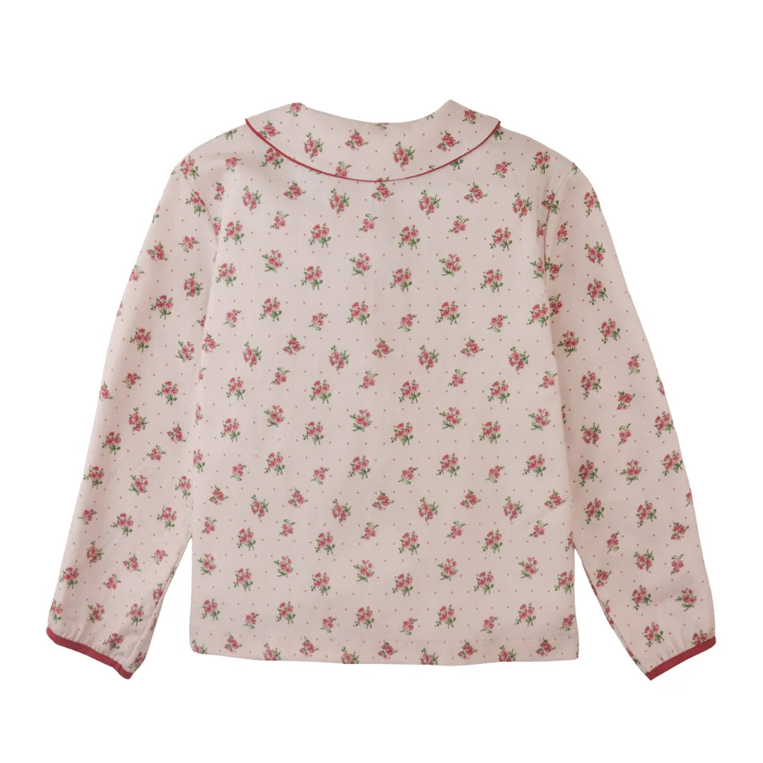 The back view of the floral Caridad blouse by Gingersnaps, showing the comfortable fit.