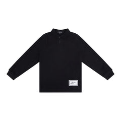 A front view of the JayBee black sherpa patch children's polo shirt.
