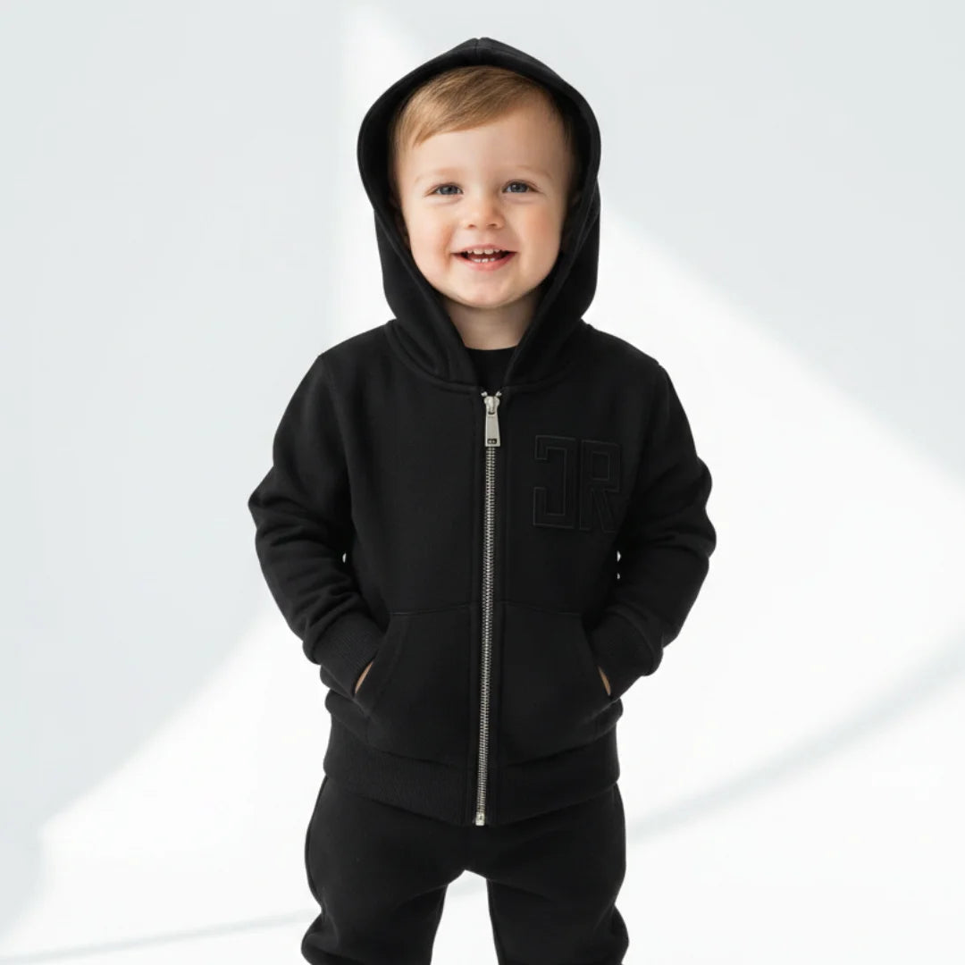 kid wearing john richmond black sweatshirt 