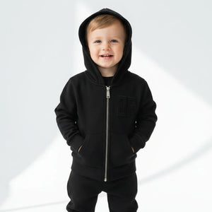 kid wearing john richmond black sweatshirt 