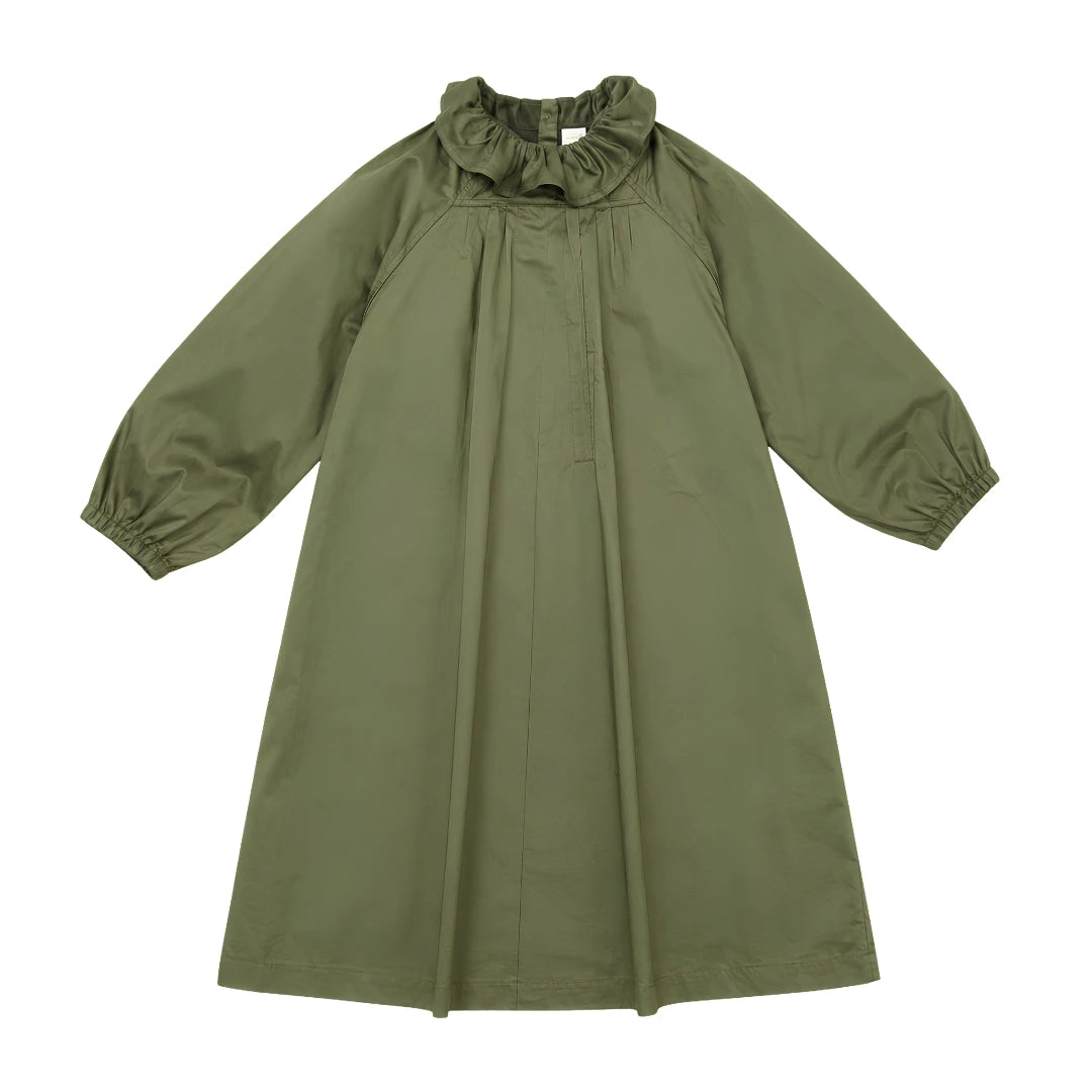 Green dress with a ruffled neckline on a white background
