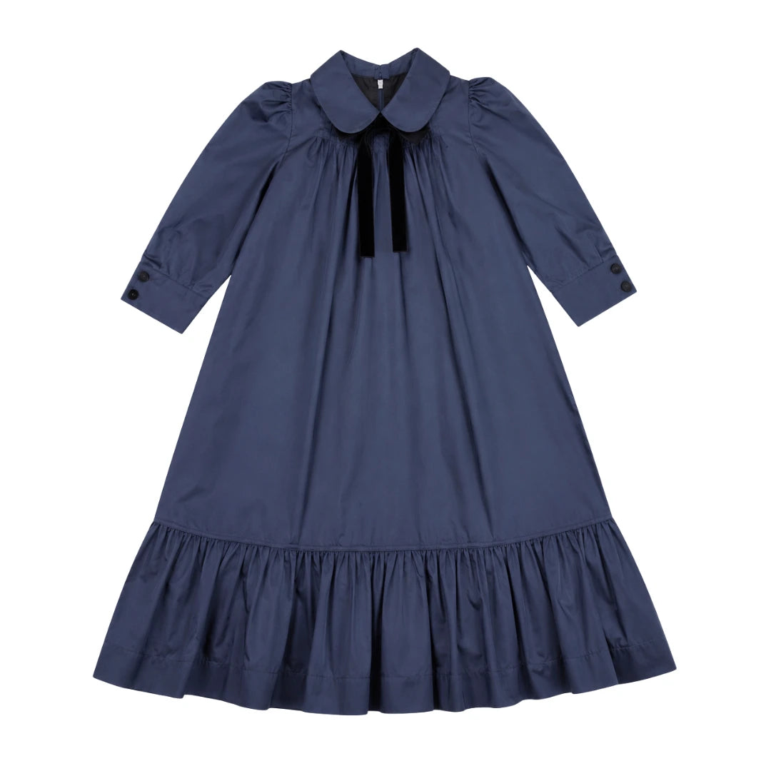 Blue dress with a ruffled collar on a white background