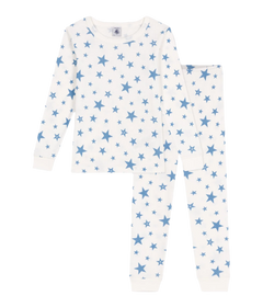 Petit Bateau white loungewear set with blue stars print, made from soft organic cotton, laid flat on a neutral background