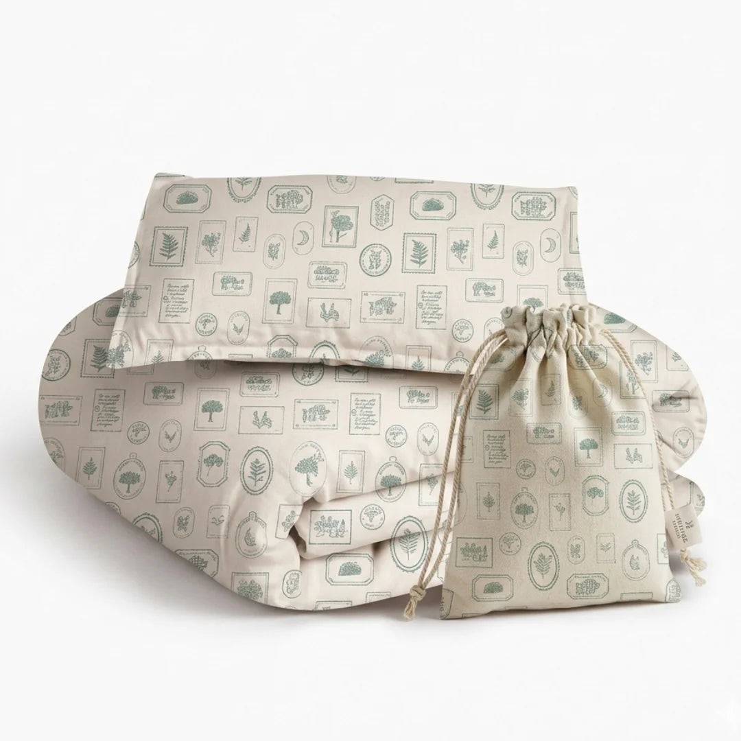 An editorial view of the Keepsake Boy's Bedding set in a modern nursery, highlighting its tailored lines and luxe fabric texture.