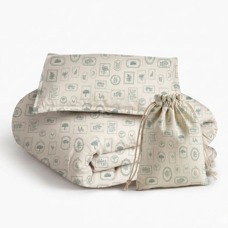 An editorial view of the Keepsake Boy's Bedding set in a modern nursery, highlighting its tailored lines and luxe fabric texture.