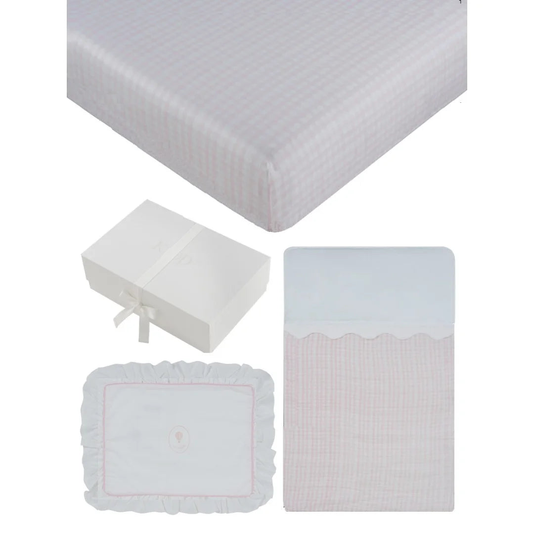 A front view of the Kipp blue and pink ciel enfant mini 4-piece crib bedding set.