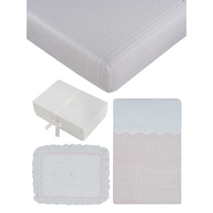 A front view of the Kipp blue and pink ciel enfant mini 4-piece crib bedding set.