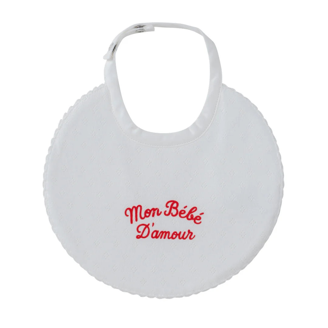A front view of the Kipp red mon bebe baby feeding bib.