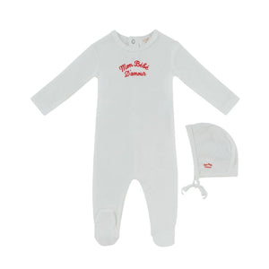 A front view of the Kipp red mon bebe baby footie and hat set.