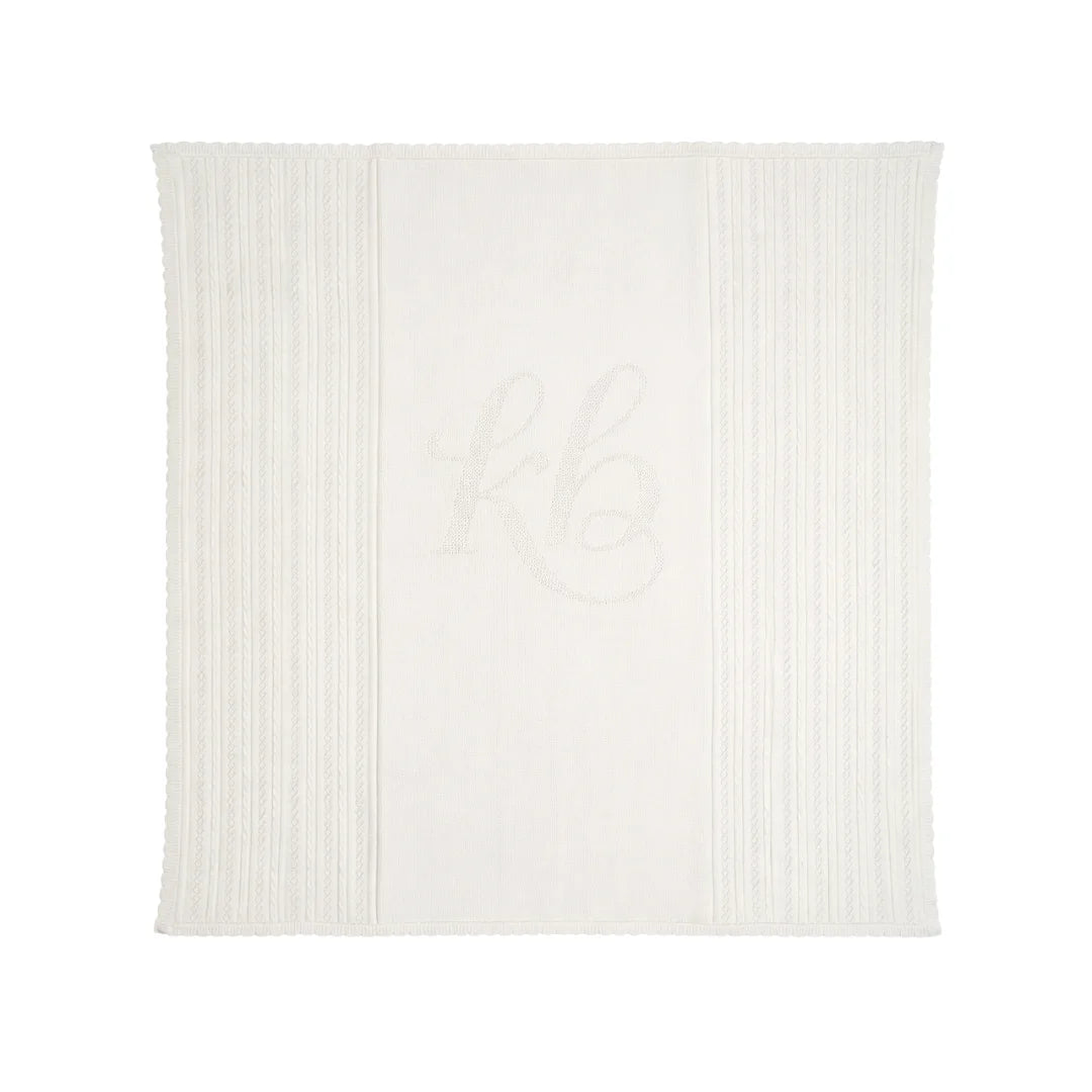 A full view of the Kipp baby white pointelle knit blanket.