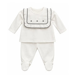 A flat-lay view of the La Mascot baby set with linen embroidered yoke.