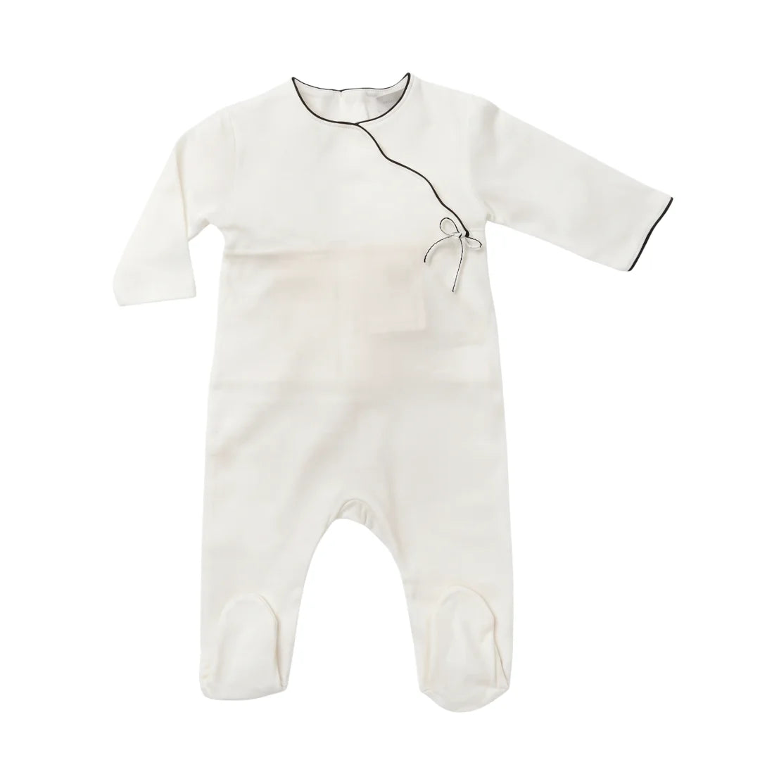A flat-lay view of the La Mascot white and blue picot trim footie.