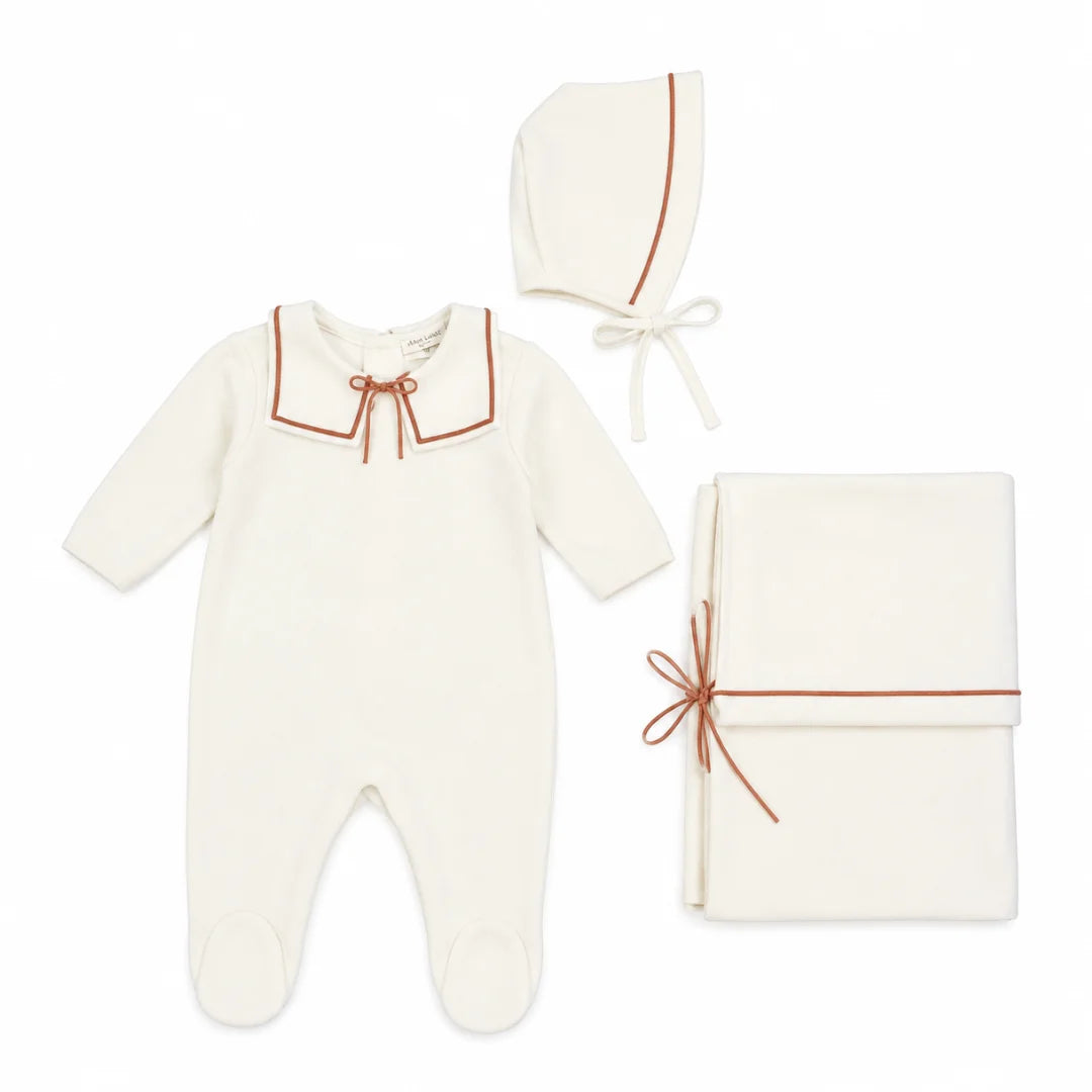 Studio front view of the La Mascot ivory and pink sailor layette 3-piece set.