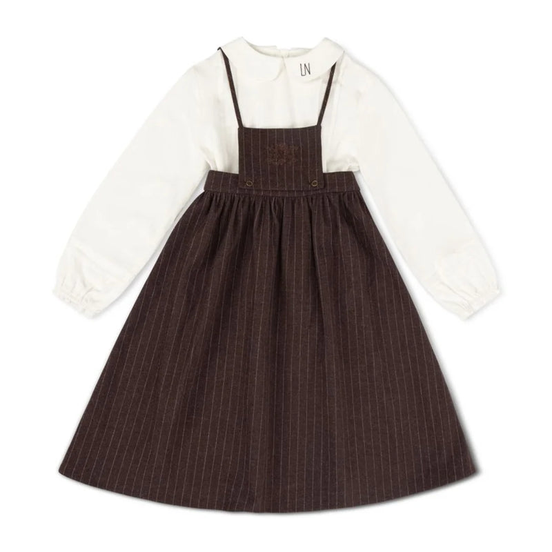 A front view of the La Nina brown pinstripe jumper and logo shirt set.