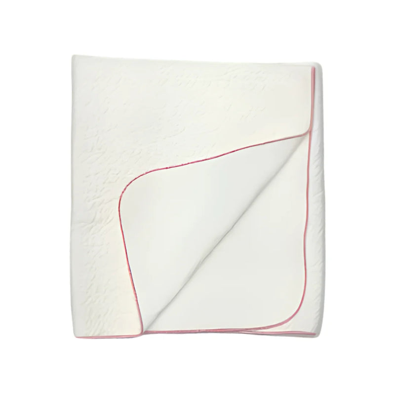 A front view of the Latte jacquard blanket in white with a mauve edge.