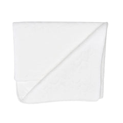 A front view of the elegant Latte Treccia Quilted Blanket.