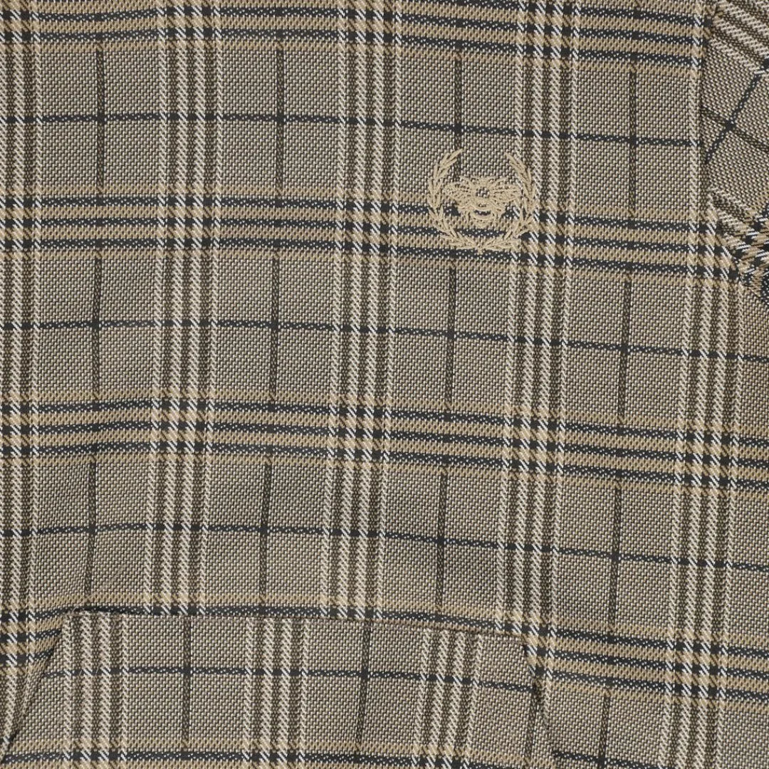 A high-resolution close-up of the soft cotton fabric texture and plaid print pattern.