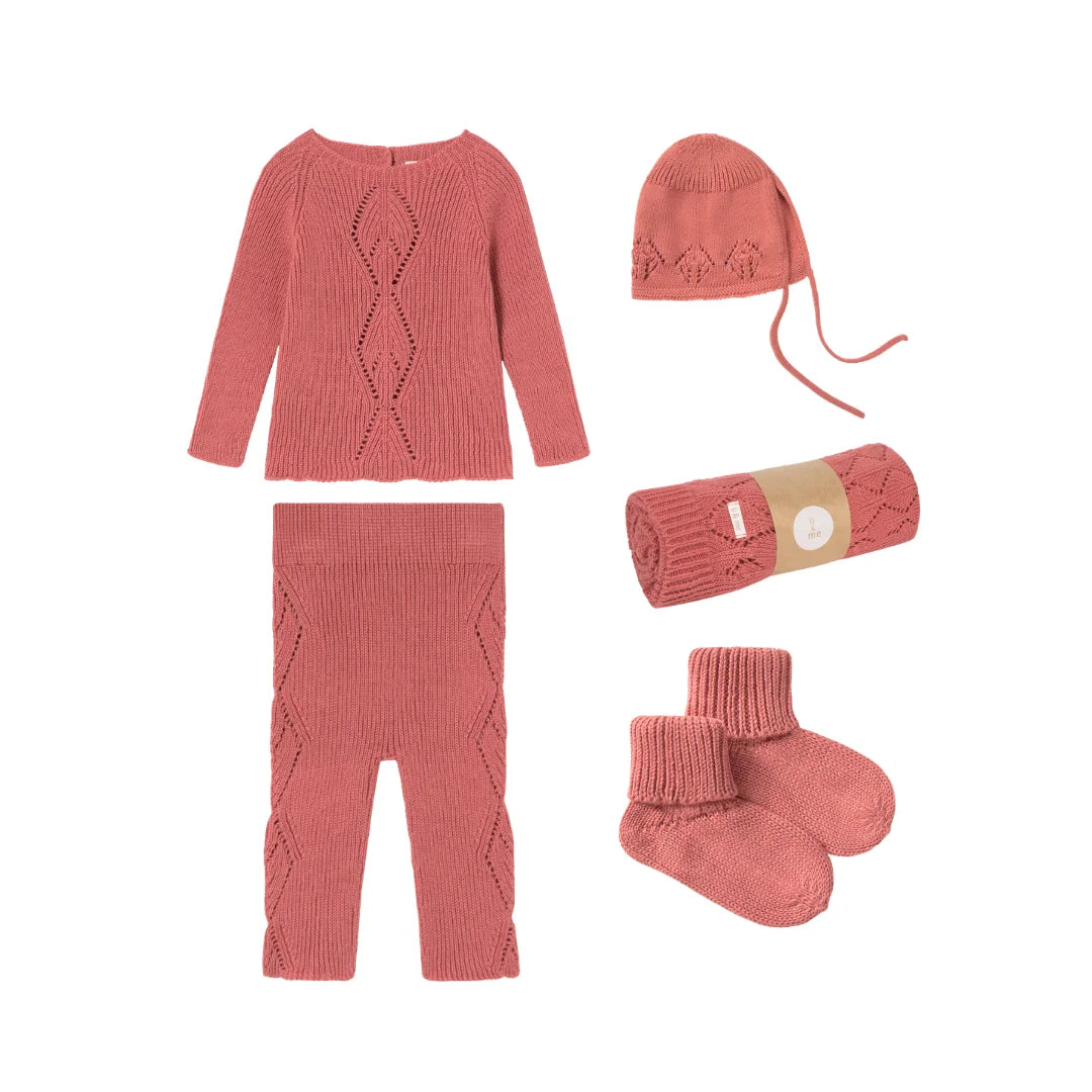 complete flatlay of the Li & Me 5-piece openwork knit newborn set.