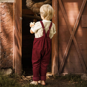 The clean back view of the comfortable toddler gingham trousers.