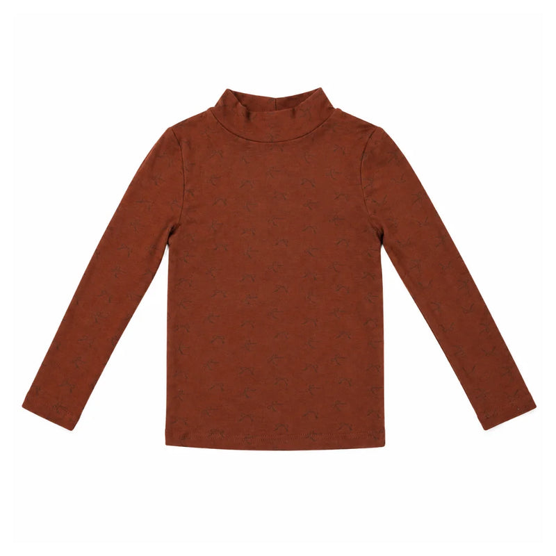 The clean back view of the comfortable mockneck top.