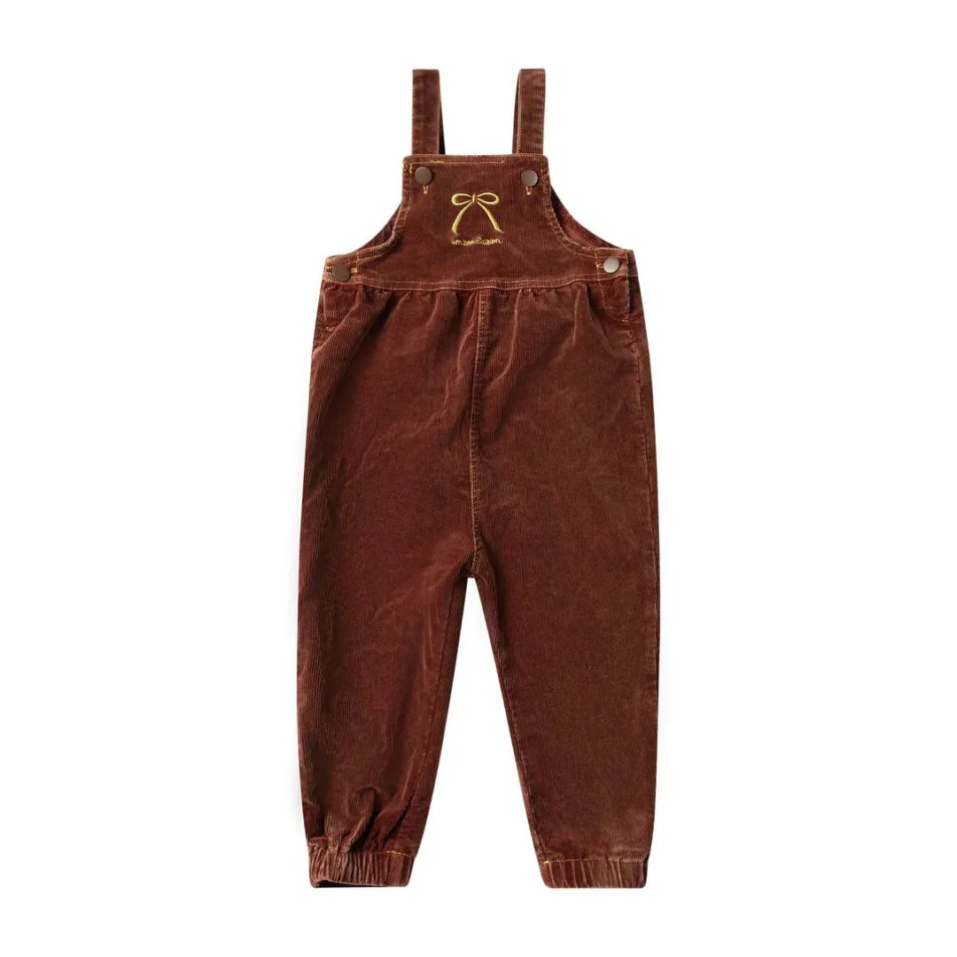 A front view of the limited edition brick embroidered bow children's overalls.