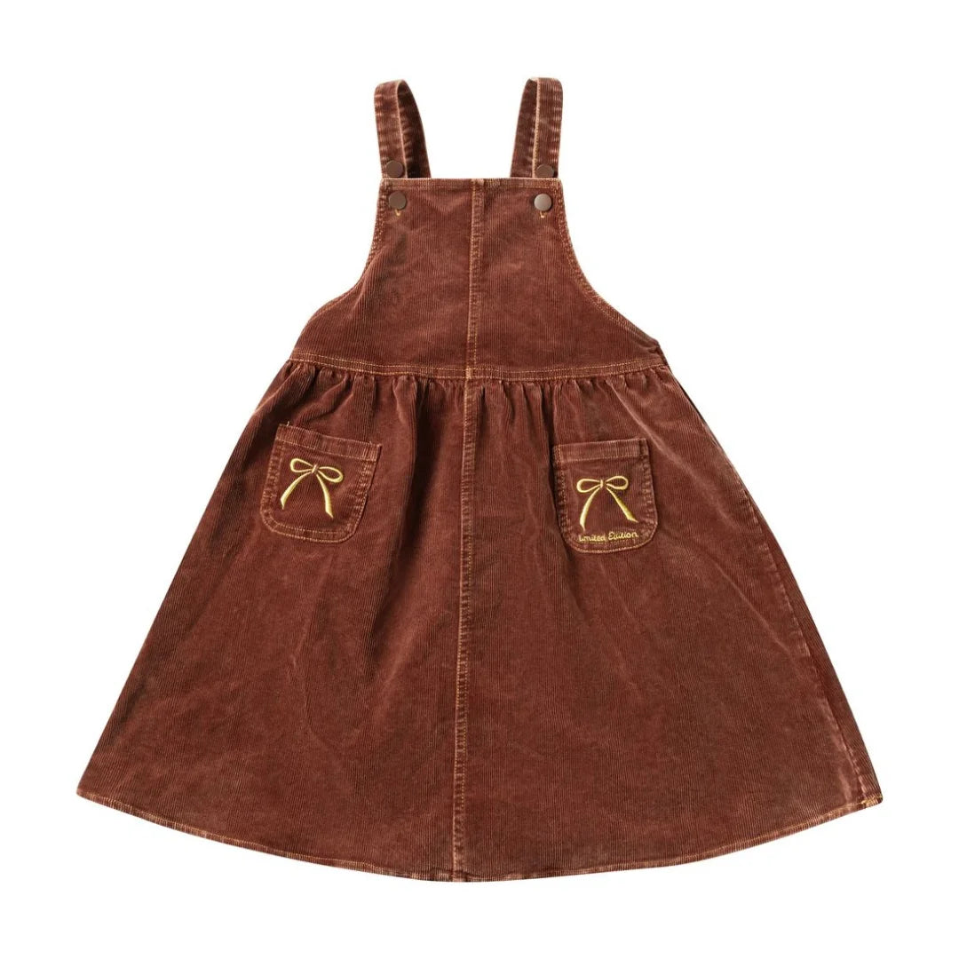A front view of the limited edition brick embroidered bow children's pinafore jumper.