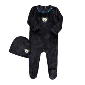 A front view of the Little Label black velour baby footie and matching hat with blue piping