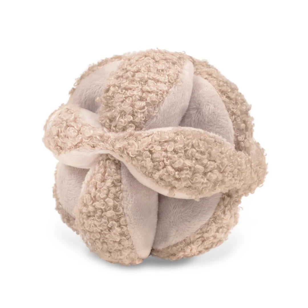 The Little Lamb Kind MONTI developmental toy in a soft oat color.