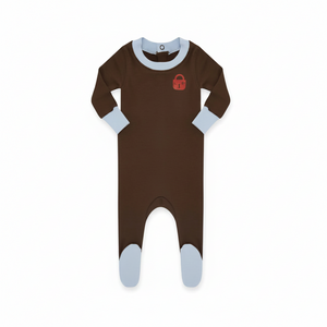 A baby footed one-piece sleeper in dark brown with light blue cuffs and toe caps, featuring a small red padlock graphic on the chest.