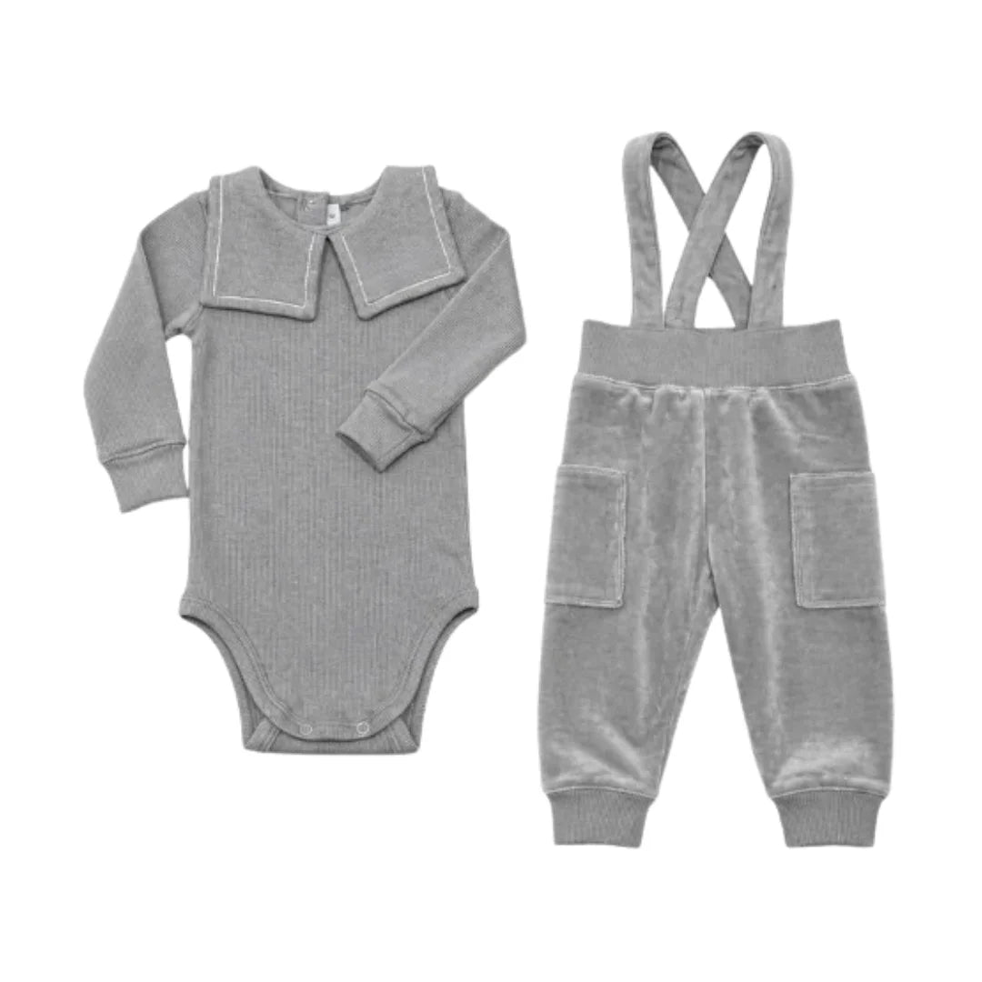 A front view of the Little Parni grey embroidered velour overall set.