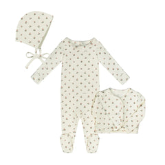 A breathtaking Little Parni Floral Cardigan Layette Set and Bonnet, showcasing its authoritative architectural fit and refined botanical print for an elegant newborn wardrobe.