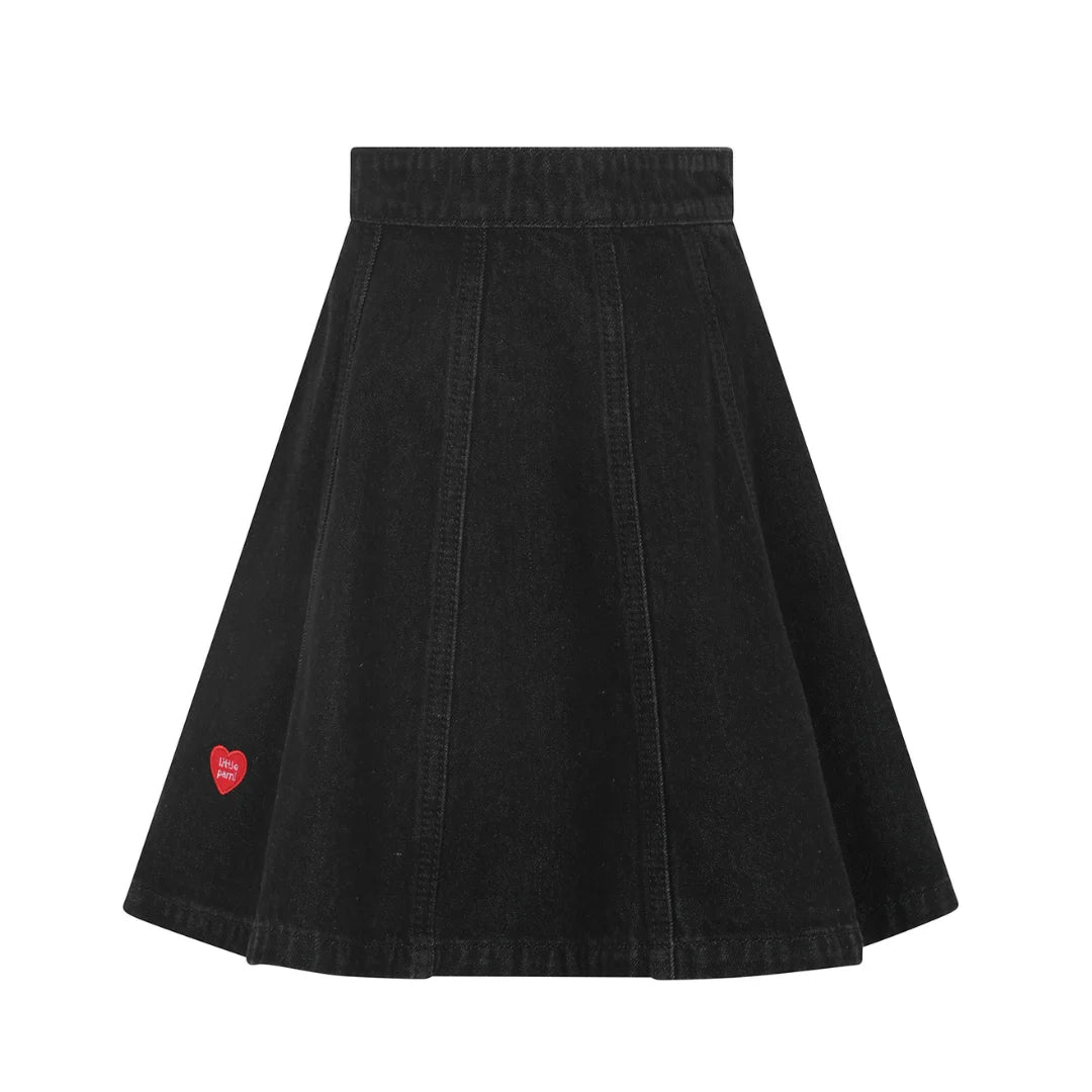 front view of the Little Parni black denim heart detail skirt.