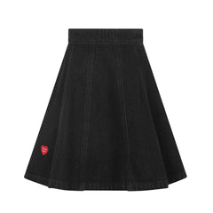 front view of the Little Parni black denim heart detail skirt.