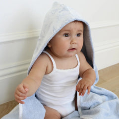 A front view of the Little Threads sky blue toile hooded bath towel.