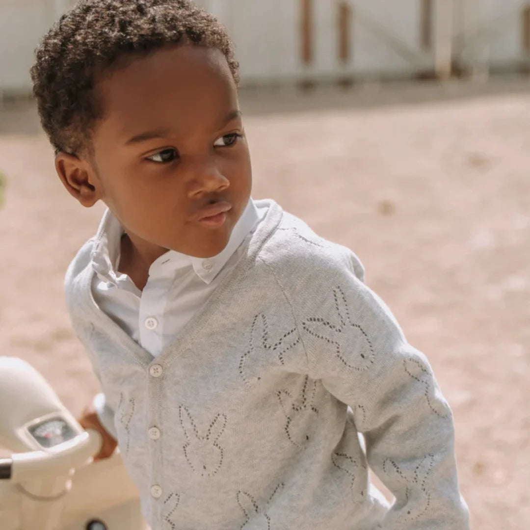 A little one wearing the grey Livly bunny cardigan for a classic, sophisticated boutique look.