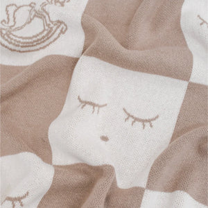 A high-resolution close-up of the delicate knit texture and the Rocking Horse motif.
