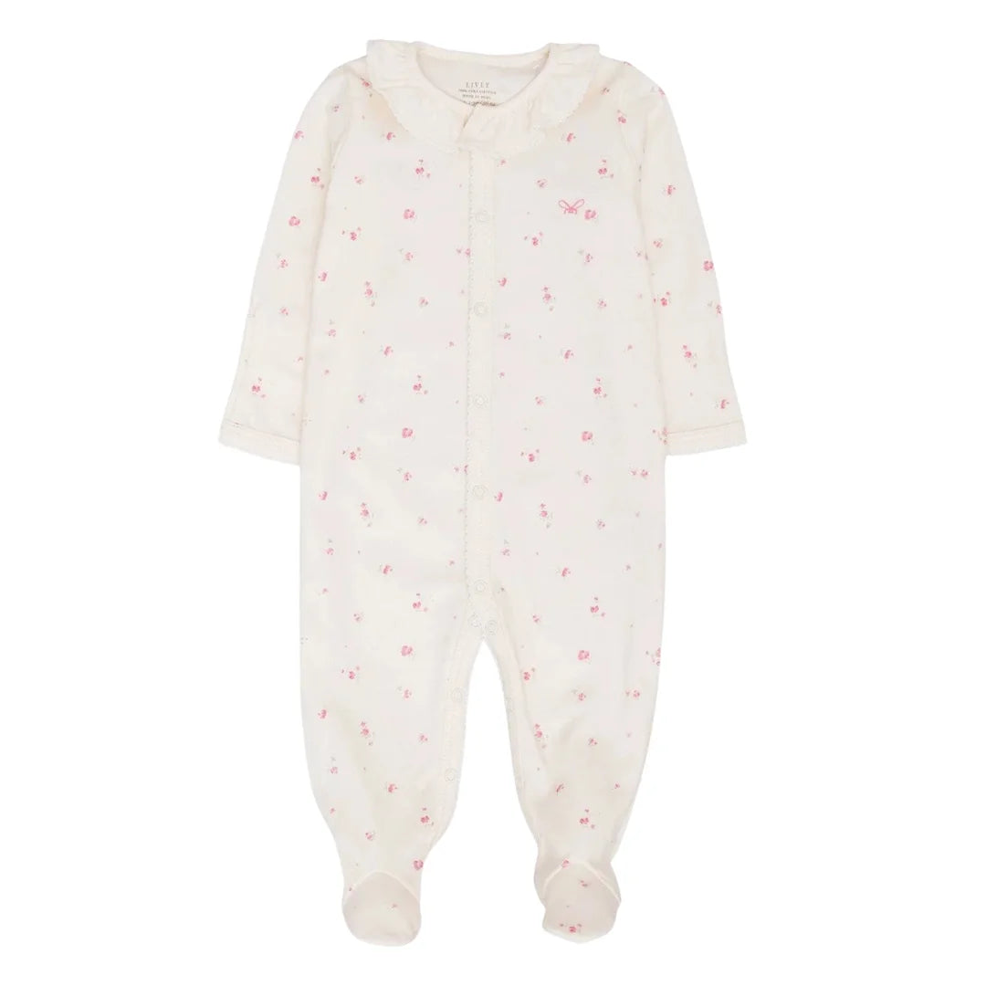 A front view of the elegant rose garden ruffled collar footie by Livly.