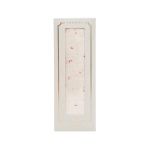 A front view of the Livly Rose Garden swaddle in Ivory.