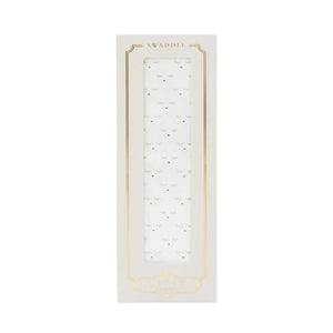A flat-lay view of the Livly Sleeping Cutie swaddle blanket in white.