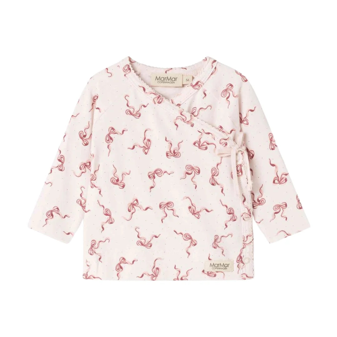 A flat-lay view of the MarMar Copenhagen Aiko footie in bows pink.
