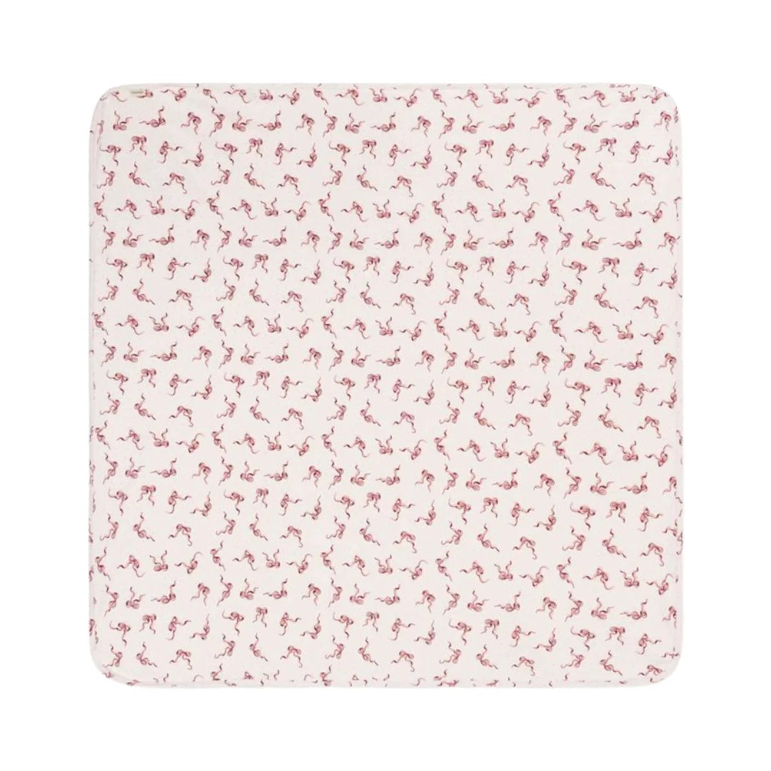 A flat-lay view of the MarMar Copenhagen Alida bows blanket in pink.