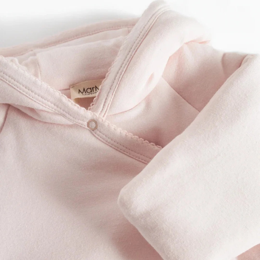 A high-resolution close-up highlighting the quilted texture and "Rosa" floral pattern.