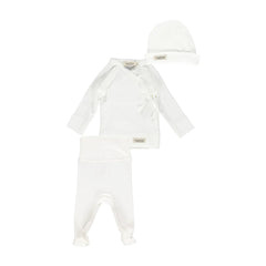A flat-lay view of the MarMar Copenhagen gentle white tut wrap and hat set.