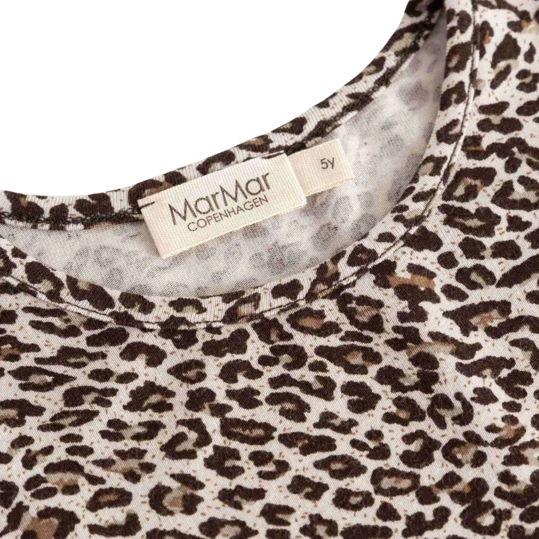 A high-resolution close-up of the organic cotton blend texture and leopard print.
