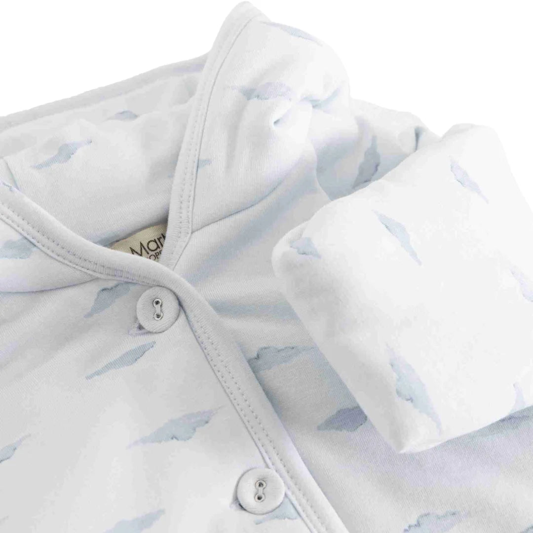 A high-resolution close-up of the soft organic cotton texture and fine stitching.